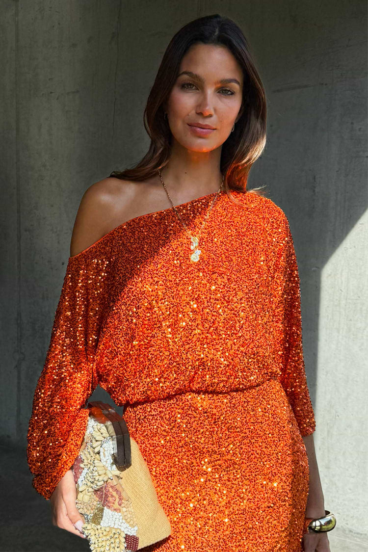 Orange Sequin Tilly Dress featuring shimmering burnt orange sequins and an asymmetric off-the-shoulder silhouette.