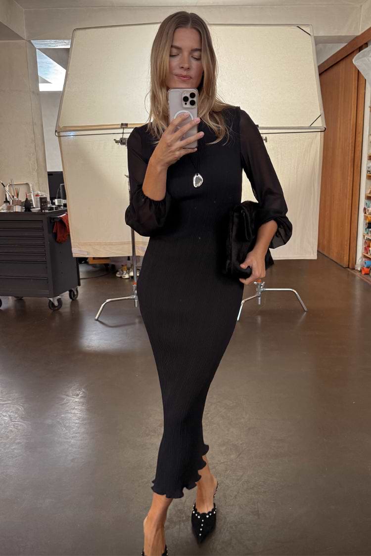 Black Plisse Perrie Dress with sheer balloon sleeves, worn by a 5ft6” model in size M, shown in a mirror selfie.