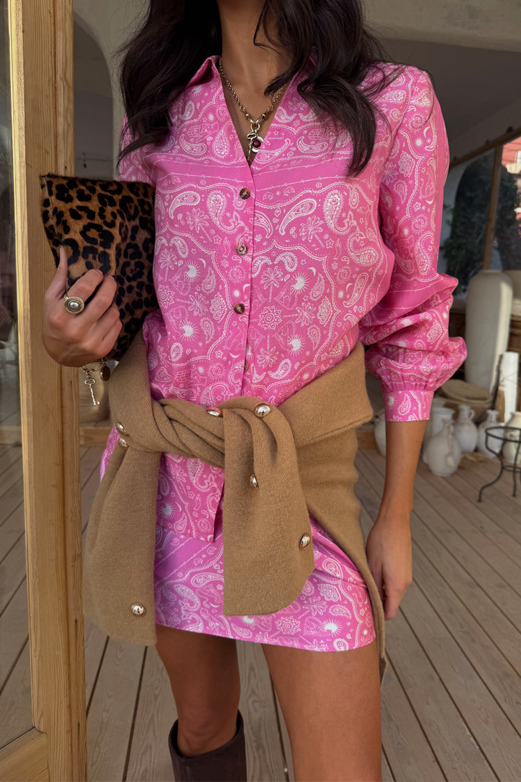 Pink Bandana Mini Dorris Skirt and matching shirt in a paisley print styled with a tan cardigan and leopard clutch.