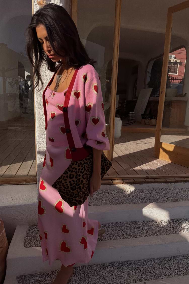 Pink Hearts Cardigan featuring red heart motifs and contrast trims, paired with a matching heart print skirt.