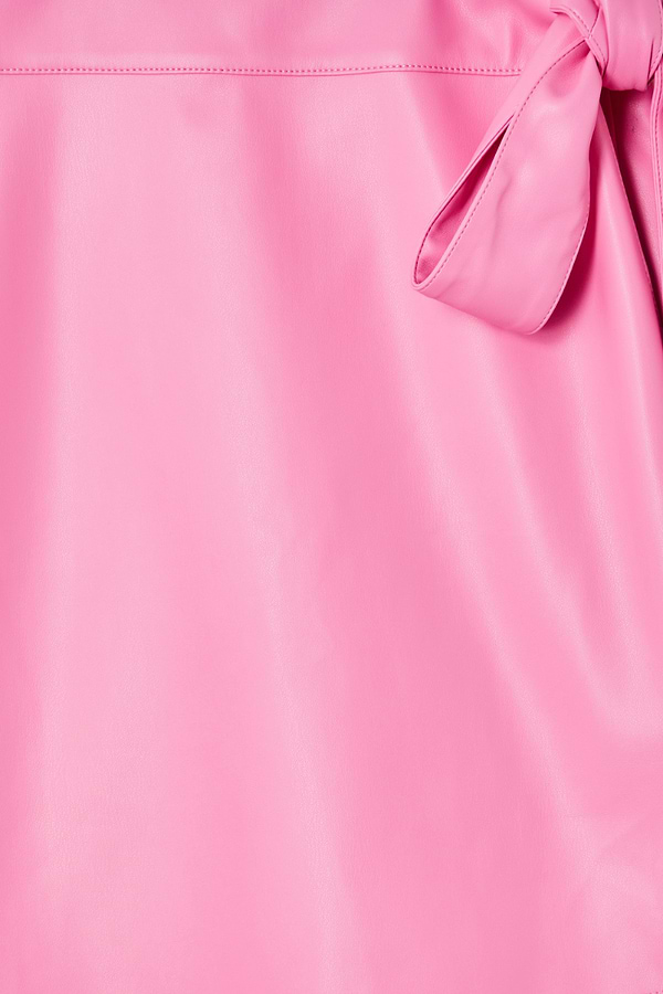 Detail of the pink vegan leather fabric and wrap tie fastening on the iconic Mini Jaspre Skirt.