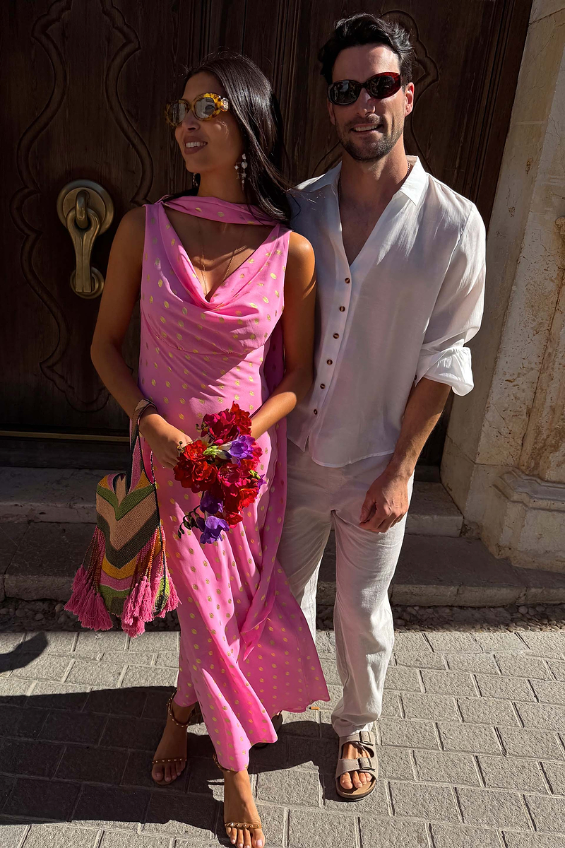 Pink Sophie Dress with shimmering gold flecks and a cowl neck, paired with a multi-wear scarf for a wedding guest look.