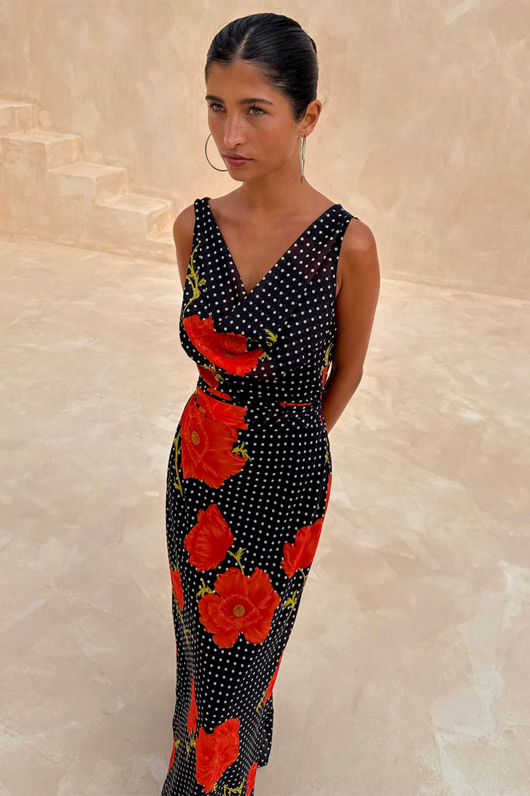 Black Poppy Sophie Dress with red floral and polka dot print, featuring a draped scarf neckline and sleeveless design.