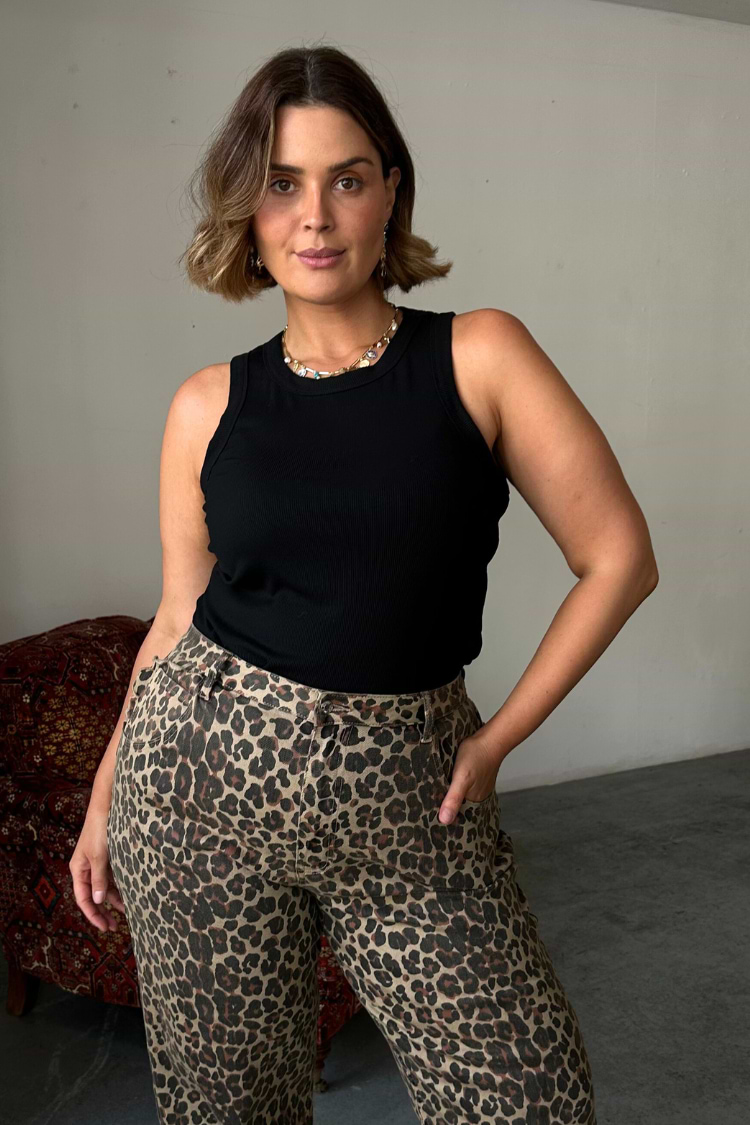 Black ribbed tank top and leopard print trousers, styled on model Pilar as an iconic London look.