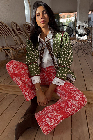 Red Bandana Jeans Petite in a paisley print, paired with a green quilted jacket and white eyelet shirt.