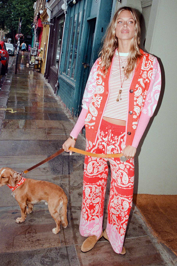 Red Bandana Martha Cardigan in a red and pink knit bandana print, styled as a co-ord on a London street.