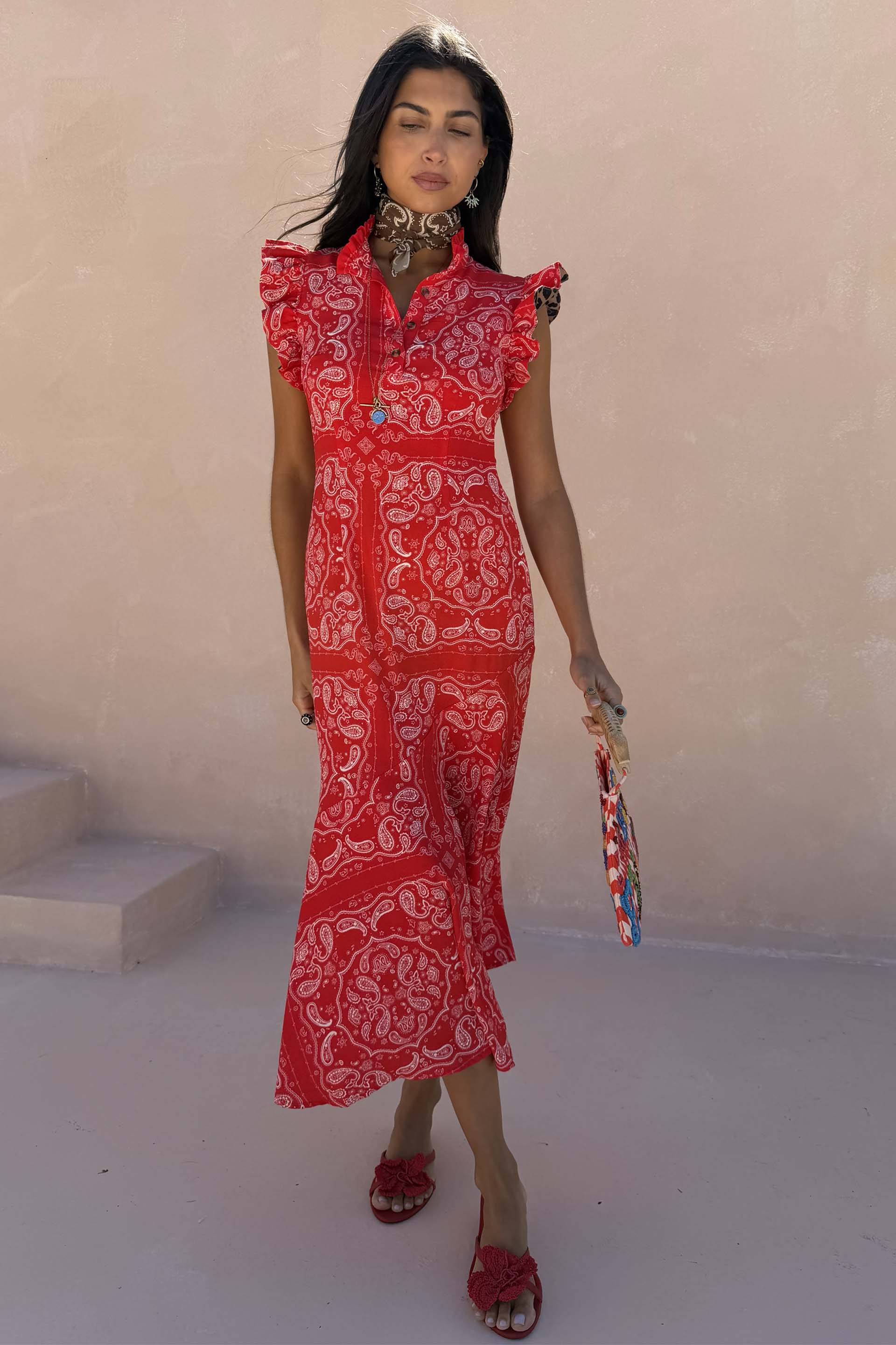 NFD Red Bandana Remi Dress with leopard sleeves and a frilled neckline, styled with a neck scarf and red floral sandals.