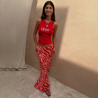 Red Snake Print Dorris Skirt in a satin-feel viscose, paired with a matching red tank top featuring a Love graphic.