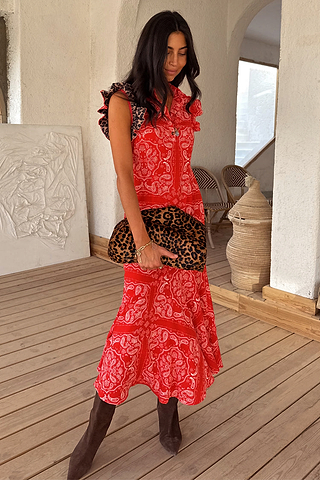 Red bandana Remi dress with leopard print ruffle sleeves and a pleated asymmetrical skirt.
