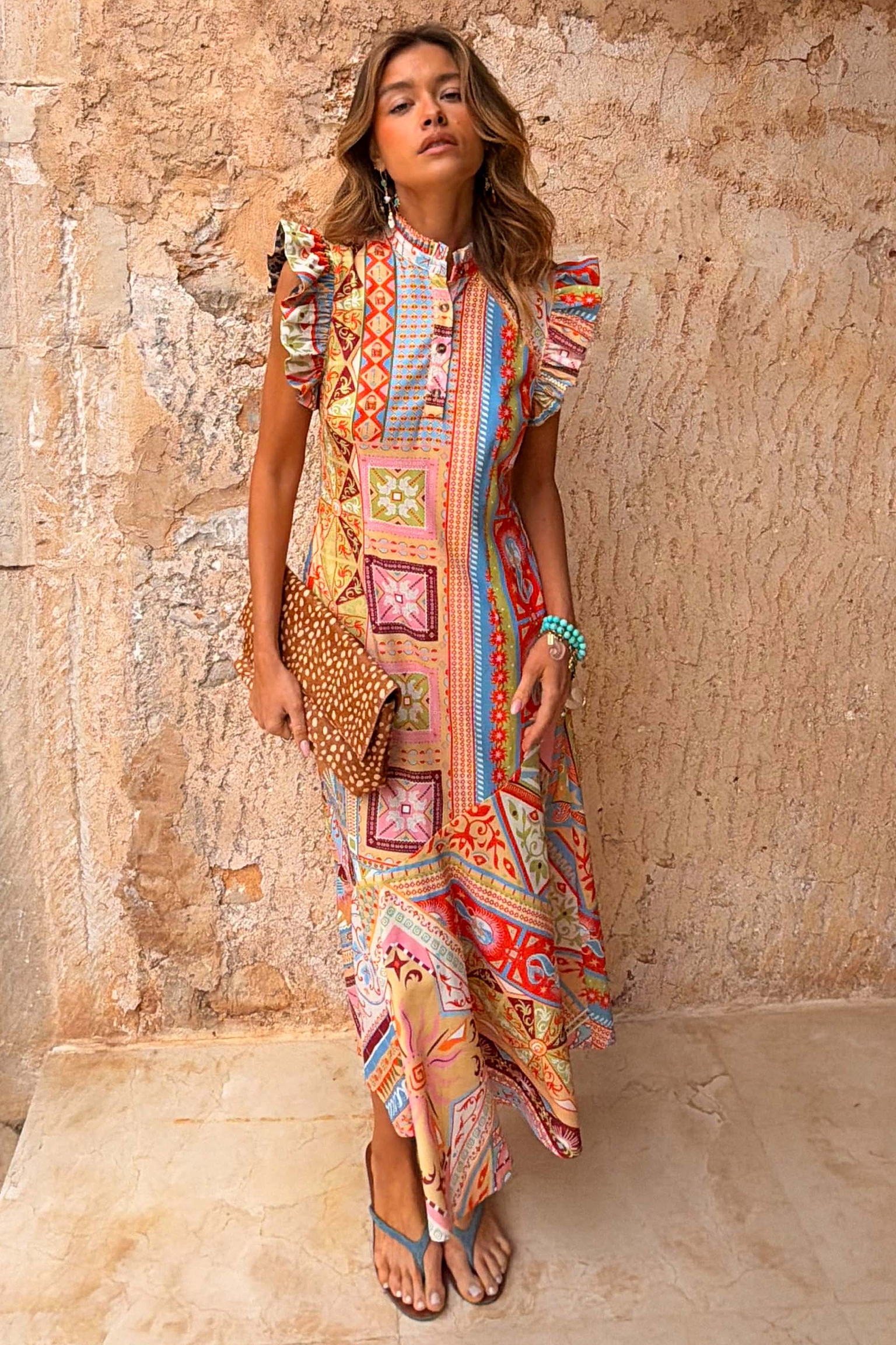 Dolce Vita Remi Dress in a sunset-toned patchwork print with a high neck and statement ruffle sleeves.