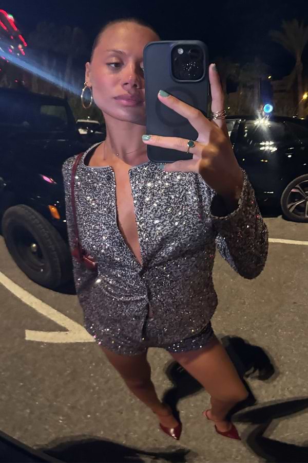 Gunmetal Alexa Sequin Cardigan and co-ord hot pants worn by a model taking a mirror selfie.