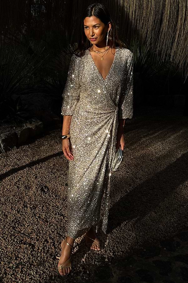 Silver Sequin Kira Wrap Dress featuring a multi-wear wrap fastening and long sleeves, styled as a maxi party dress.