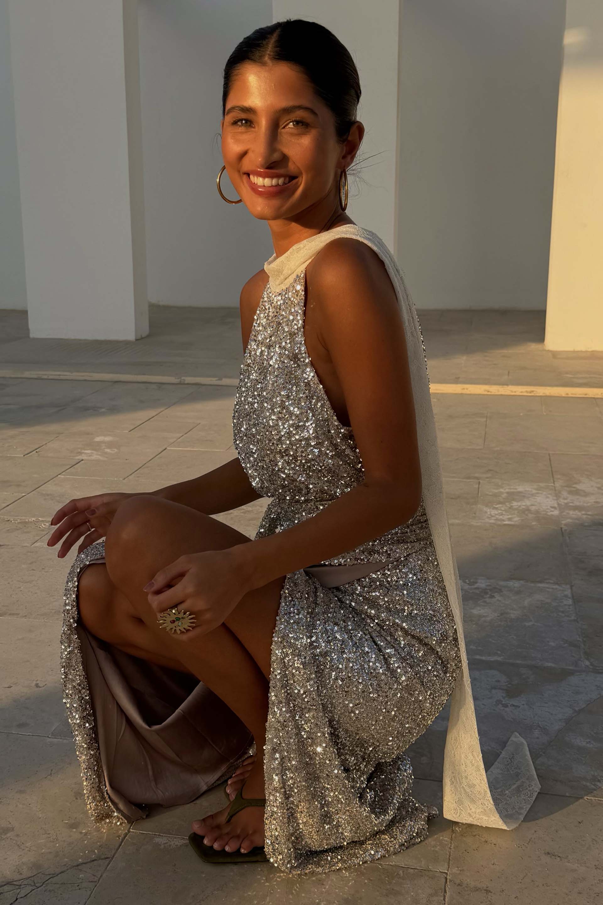 Silver Sequin Lily Top with white lace tie-neck fastenings, styled as a multi-wear piece with a matching skirt.