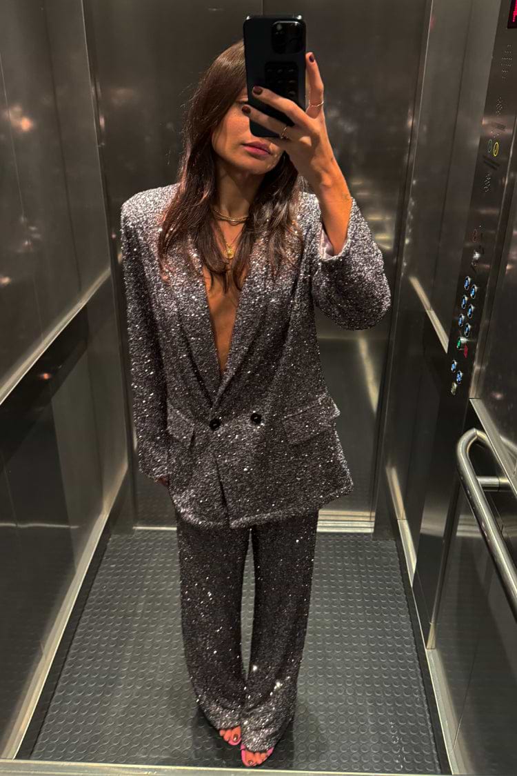 Gunmetal Sequin Freddie Trousers and matching blazer styled as a shimmering party co-ord in an elevator selfie.