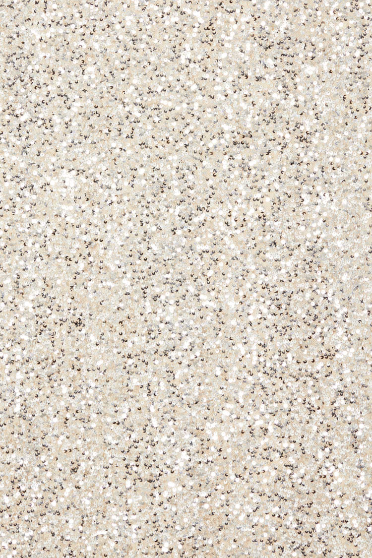 Silver Sequin Mini Soho Dress fabric detail featuring shimmering silver sequins on a neutral base.