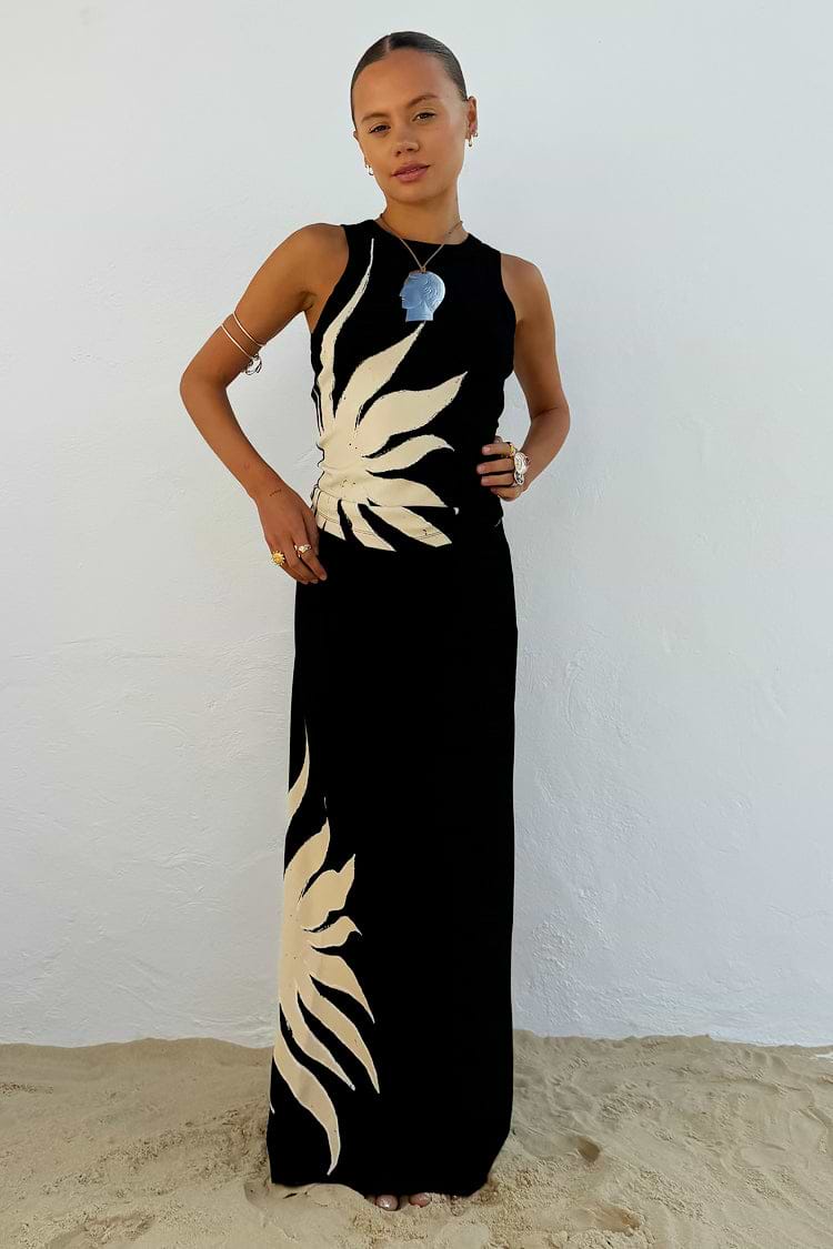 Black Sol Tank Top with an in-house designed cream sun motif, paired with a matching maxi skirt for a beach holiday look.