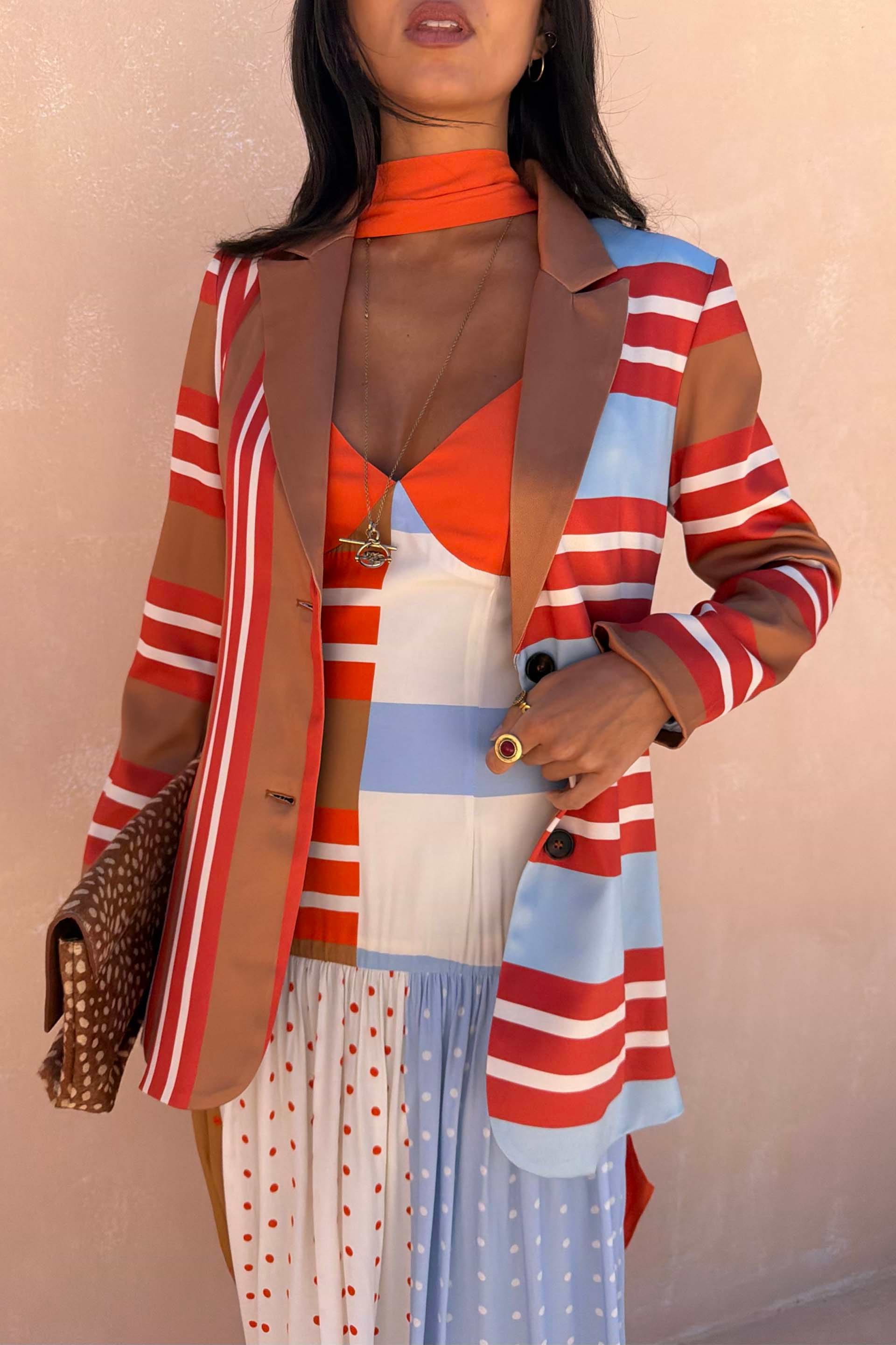 Longline Multi Stripe Blazer in red and blue, designed in London and styled with a leopard print clutch.