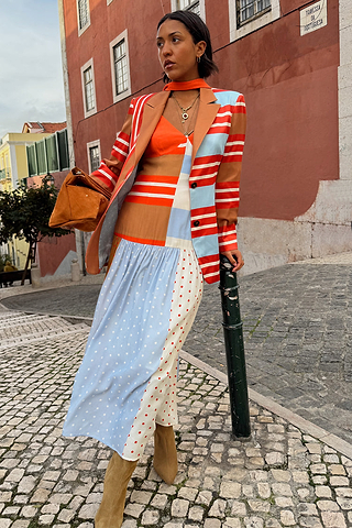 Longline Multi Stripe Blazer with red and blue stripes, styled with a mixed print dress on a cobblestone street.