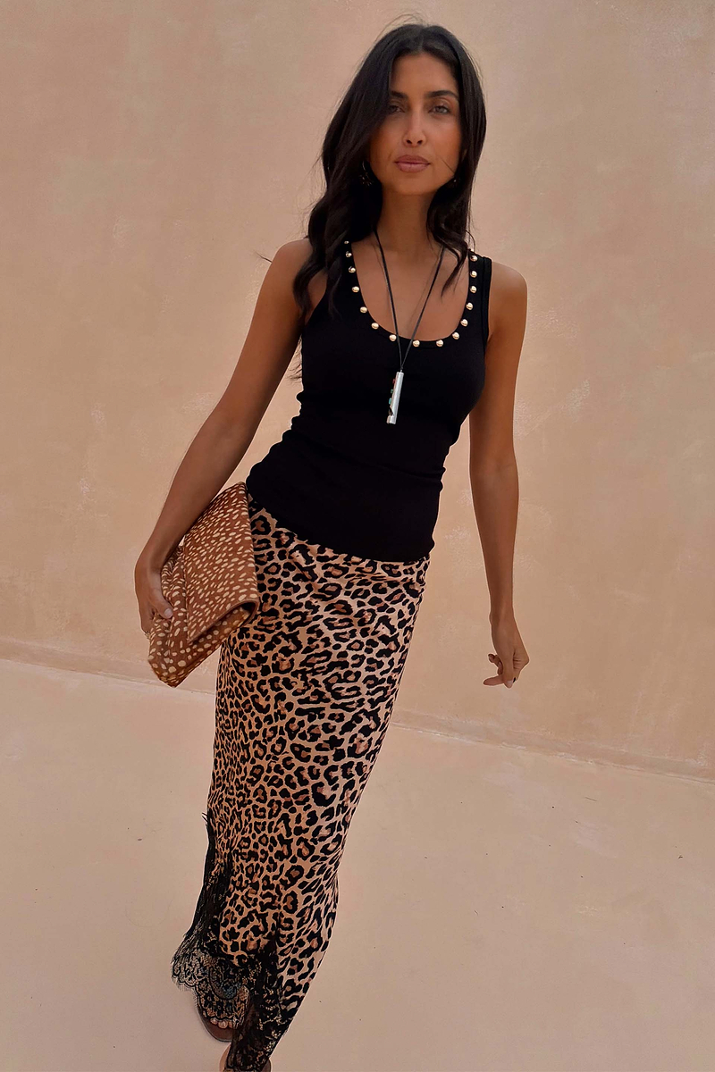 Black Studded Rib Vest with gold stud detailing at the neckline, styled with a leopard print midi skirt.