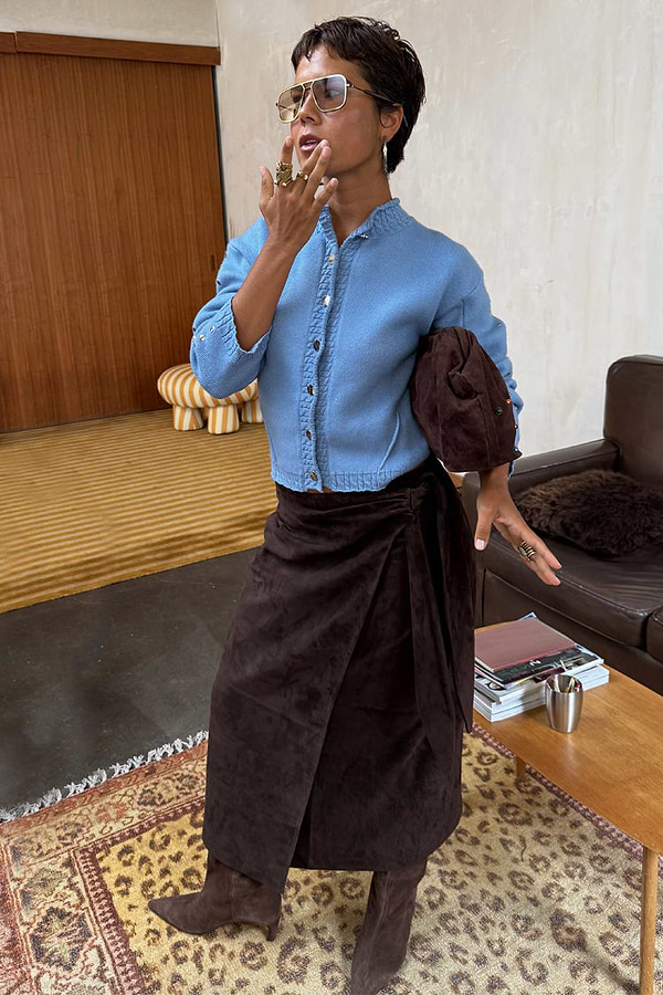 NFD Chocolate Suede Jaspre wrap midi skirt styled with a blue cardigan and brown suede boots.
