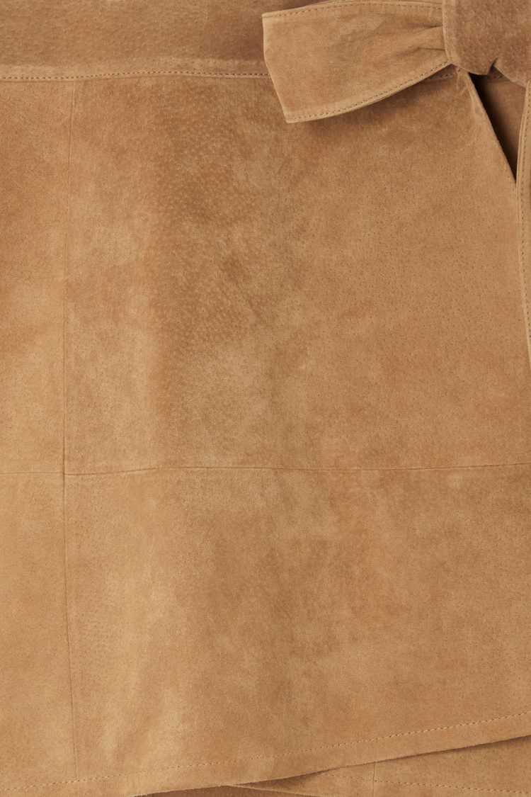 Iconic Tan Suede Mini Jaspre Skirt close-up highlighting the wrap waist tie and texture.