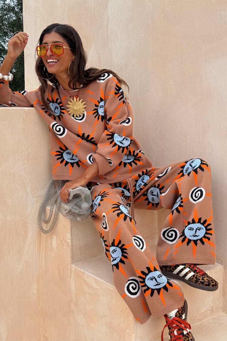 Tan Sun Trousers in a soft stretch knit with a sun and swirl motif, styled as a co-ord set on a model.