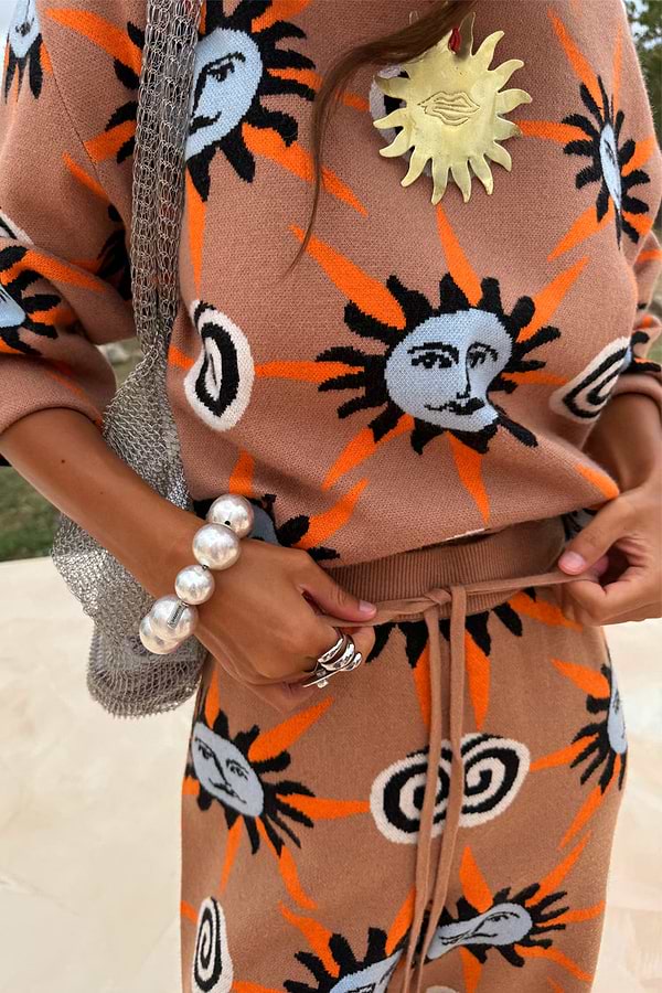 Tan Sun knit co-ord with hand-painted sun motifs, featuring a drawstring waist and soft stretch finish.