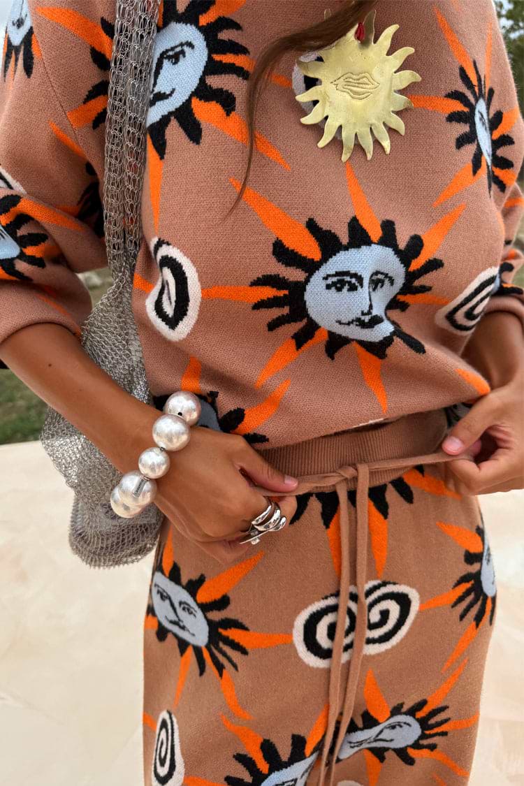 Tan Sun knit co-ord with hand-painted sun motifs, featuring a drawstring waist and soft stretch finish.