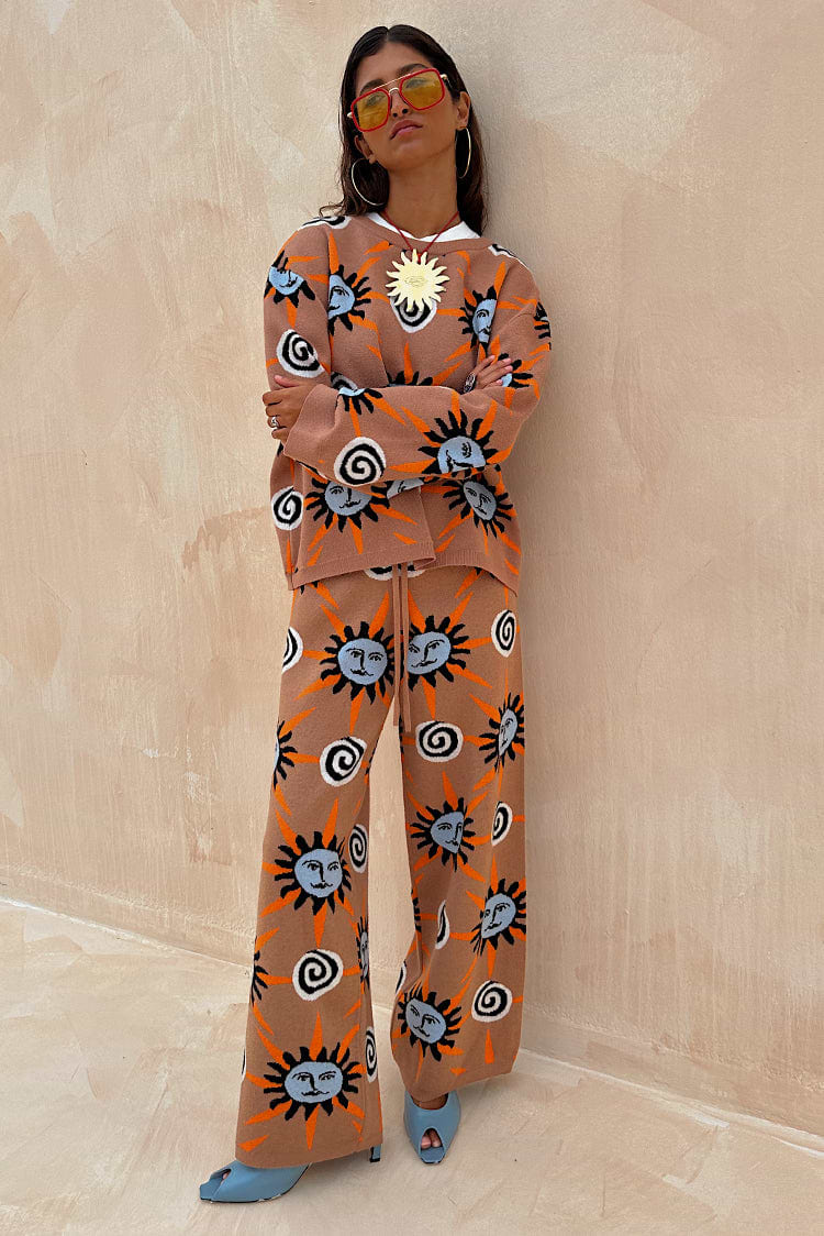 Tan Sun Copenhagen Jumper and trousers co-ord featuring orange and blue Mediterranean motifs on a soft tan knit.