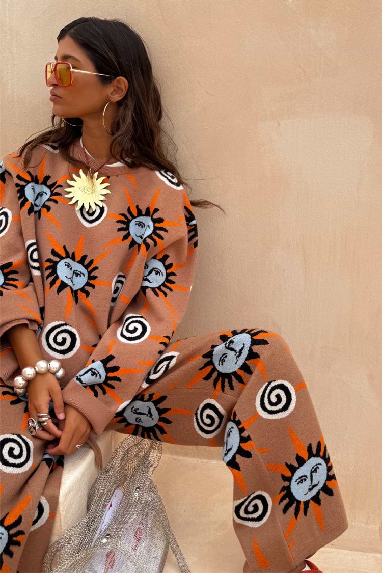 Tan Sun Copenhagen Jumper and matching knit trousers with hand-painted sun and swirl motifs.