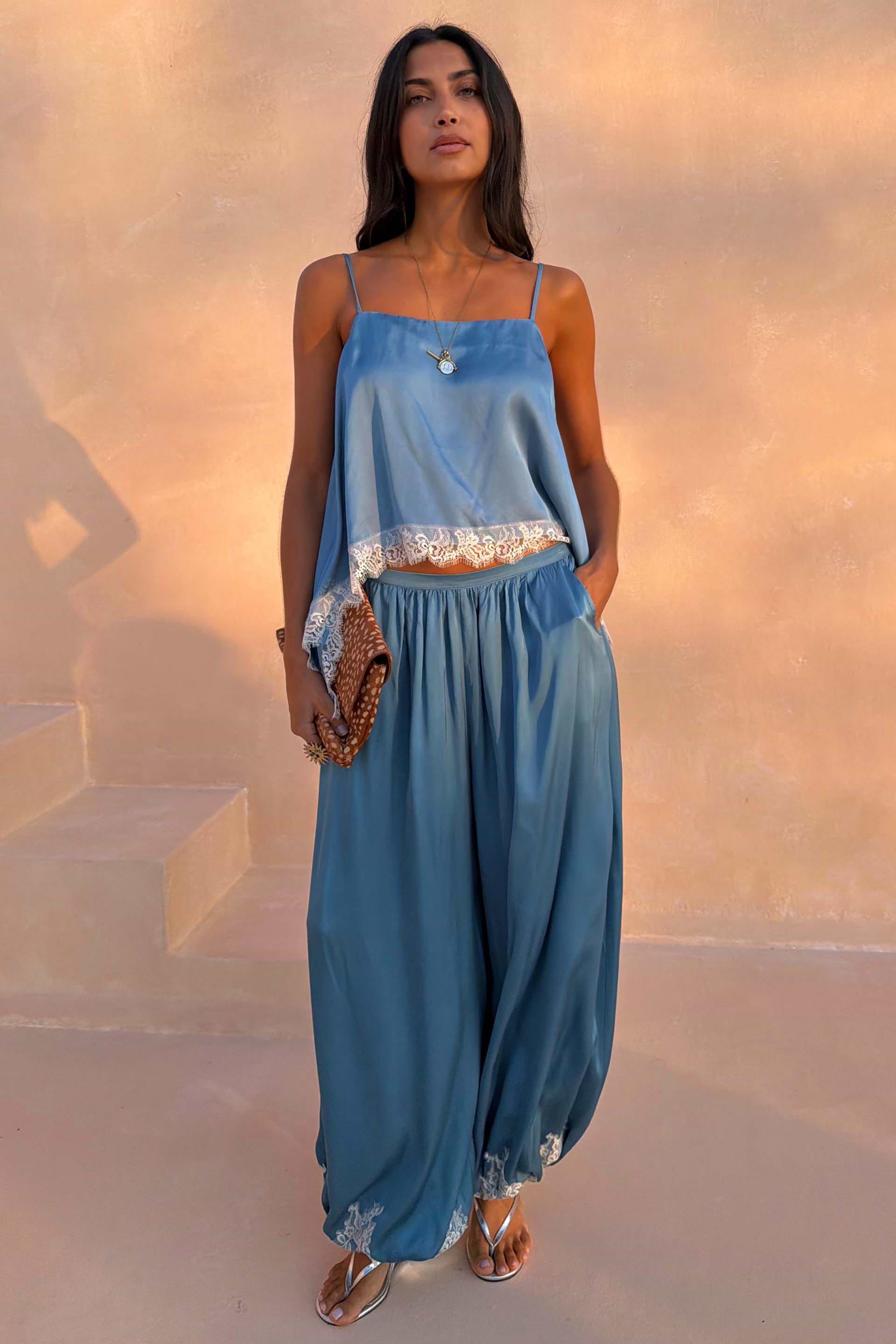 Blue Lace Balloon Trousers in washed blue satin with delicate lace trims and a fluid wide-leg silhouette.