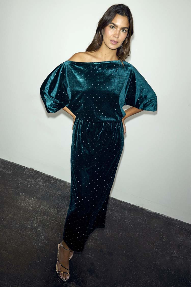 Emerald Velvet Tilly Dress with silver studs, an off-the-shoulder neckline and voluminous sleeves.