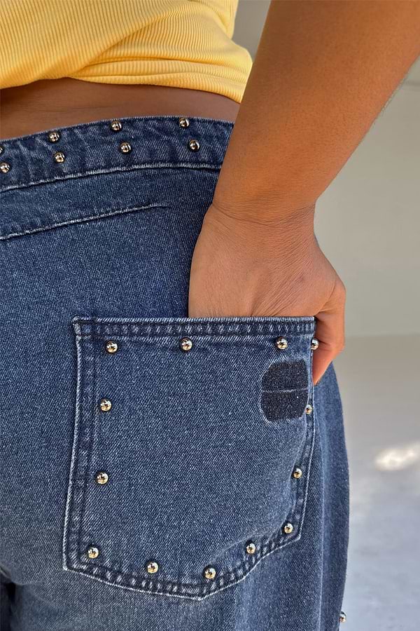 Blue Studded Barrel Jeans detail showing silver studs on the waistband and back pocket with the NFD logo.
