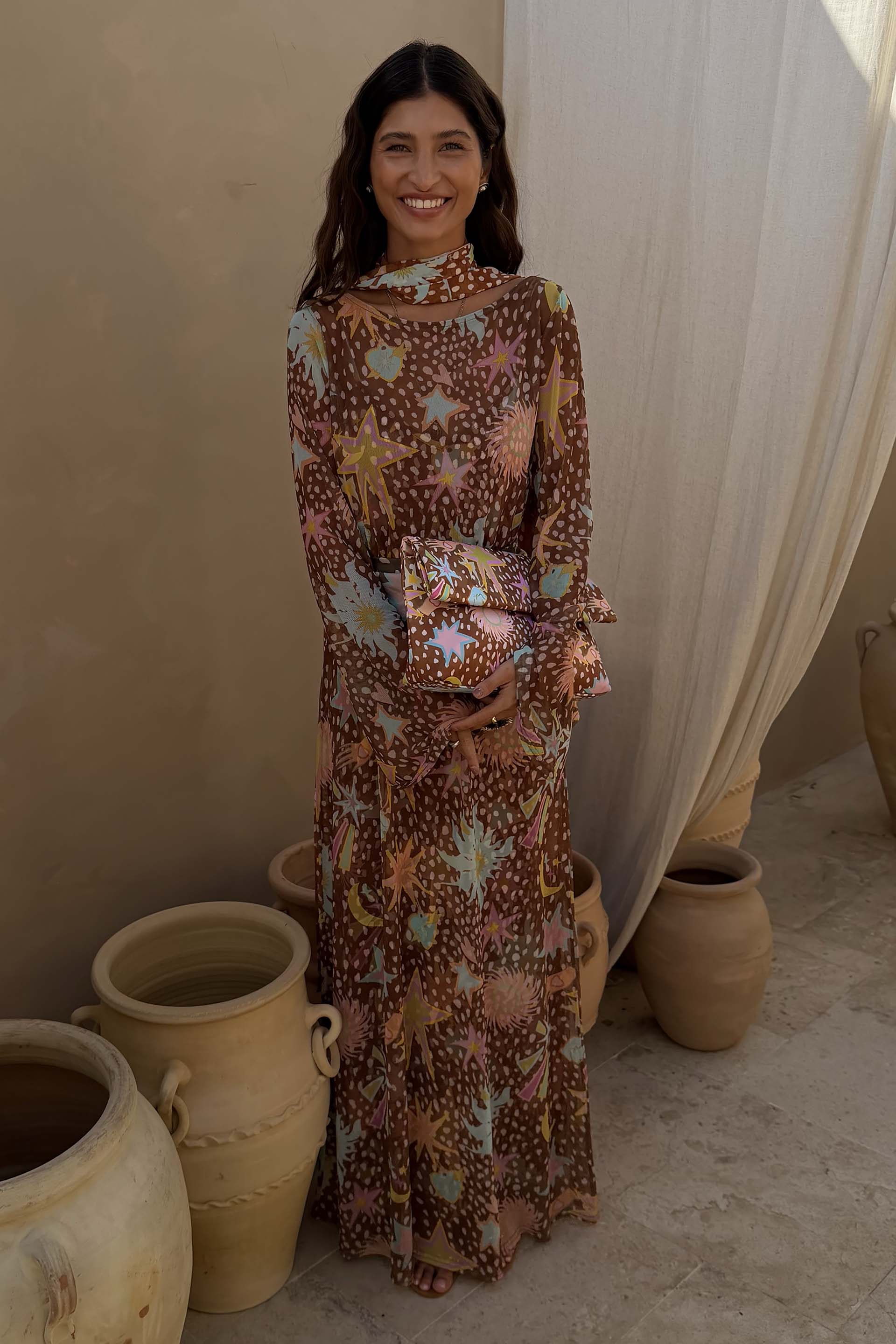 Star Fawn Aria Mesh Dress in brown with sun and star motifs, featuring flared sleeves and a matching scarf.