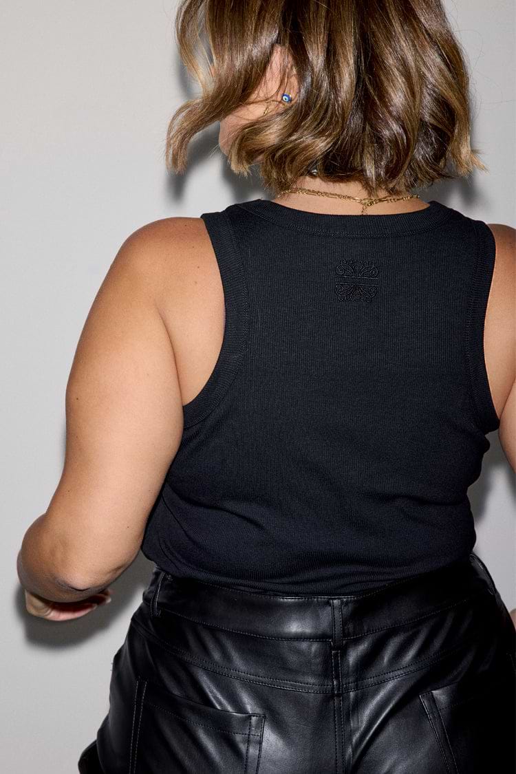 Black Ribbed Tank featuring a tonal embroidered NFD logo on the back, crafted from soft stretch ribbed fabric.