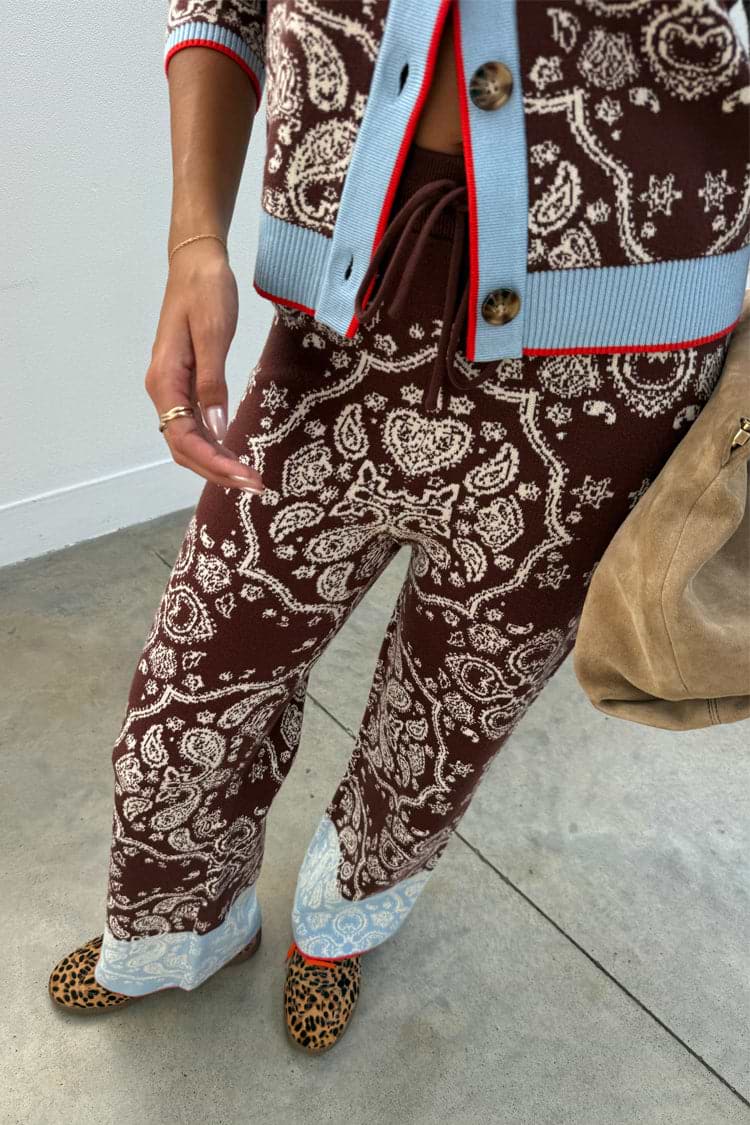 Chocolate brown bandana wide leg knit trousers featuring a blue contrast hem and drawstring waistband.