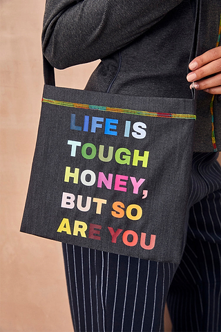 Charcoal Life is Tough Honey Drainage Bag with a rainbow 'Life Is Tough Honey, But So Are You' slogan and top stitching.