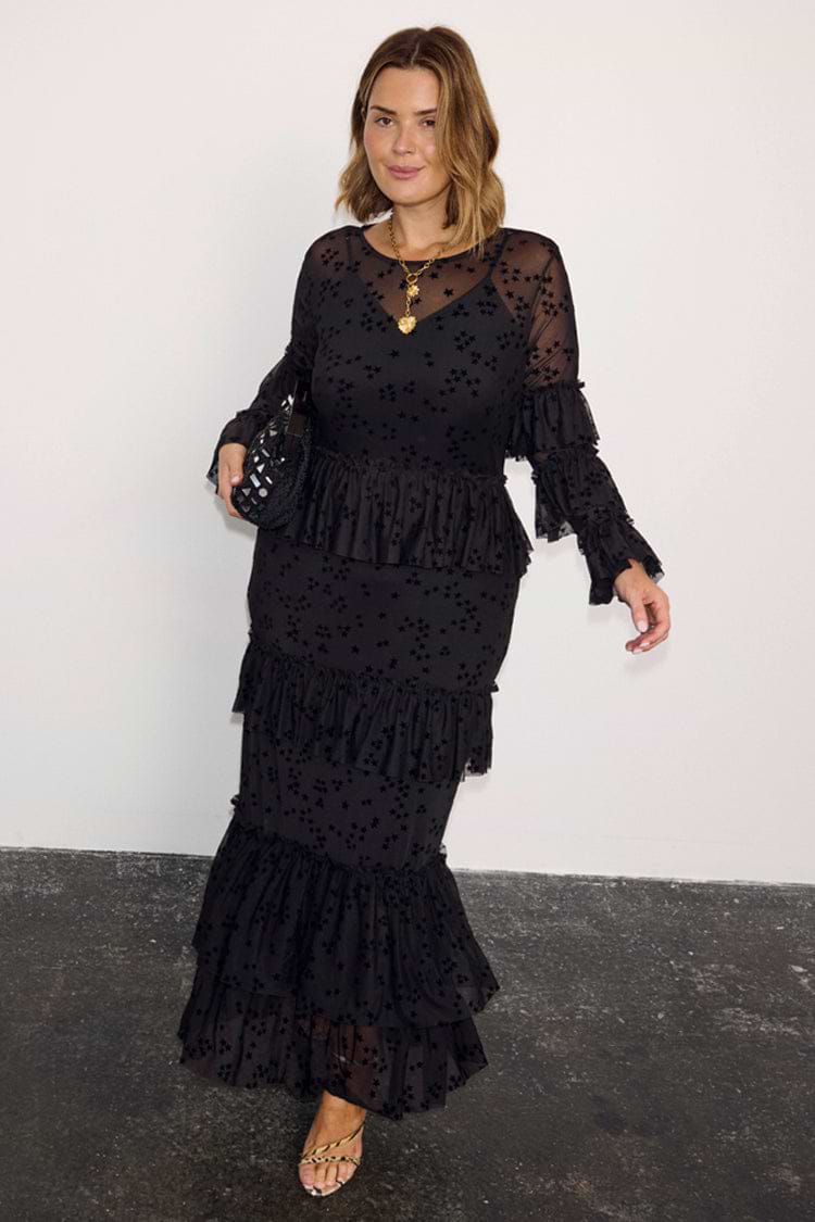 Black Star Devore Felicity Dress featuring tiered mesh ruffles and velvet star motifs on a curve model.