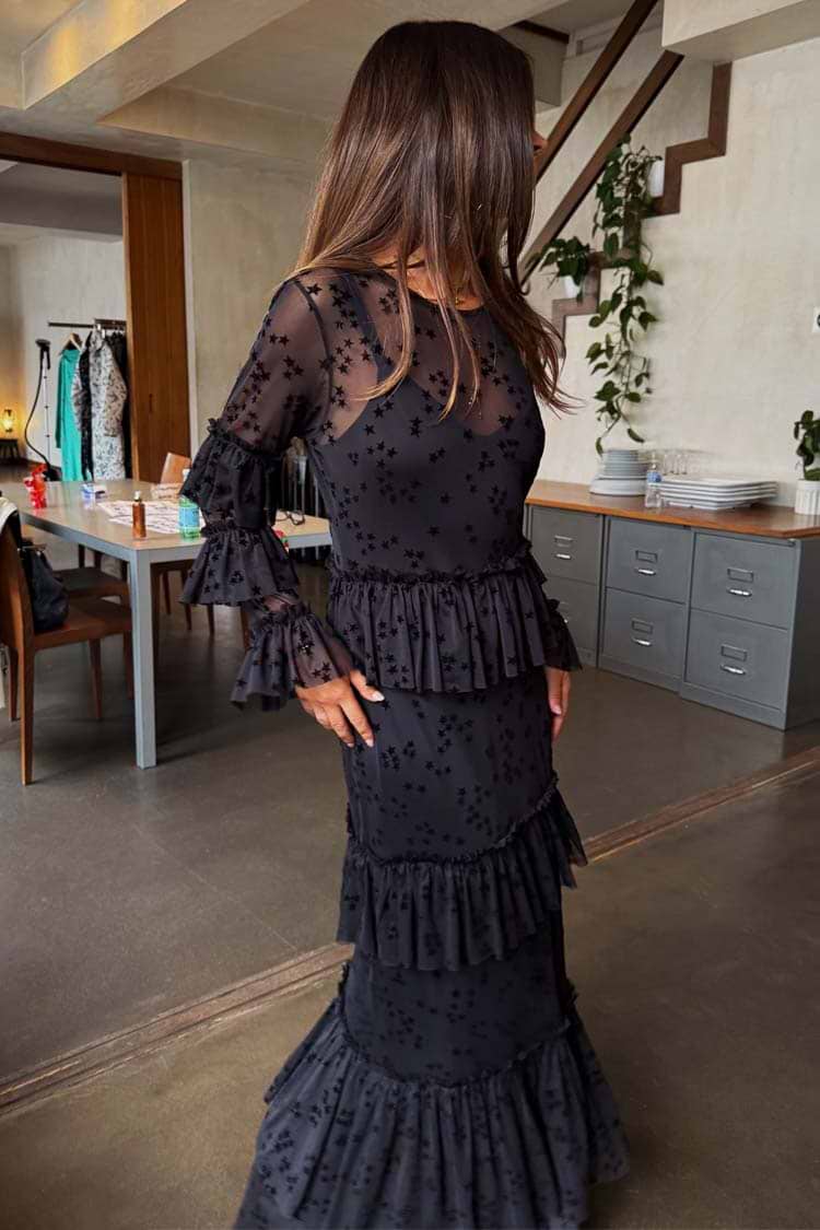 Black Star Devore Felicity Dress in sheer mesh with velvet stars, moon motifs and tiered ruffles, shown on a model.
