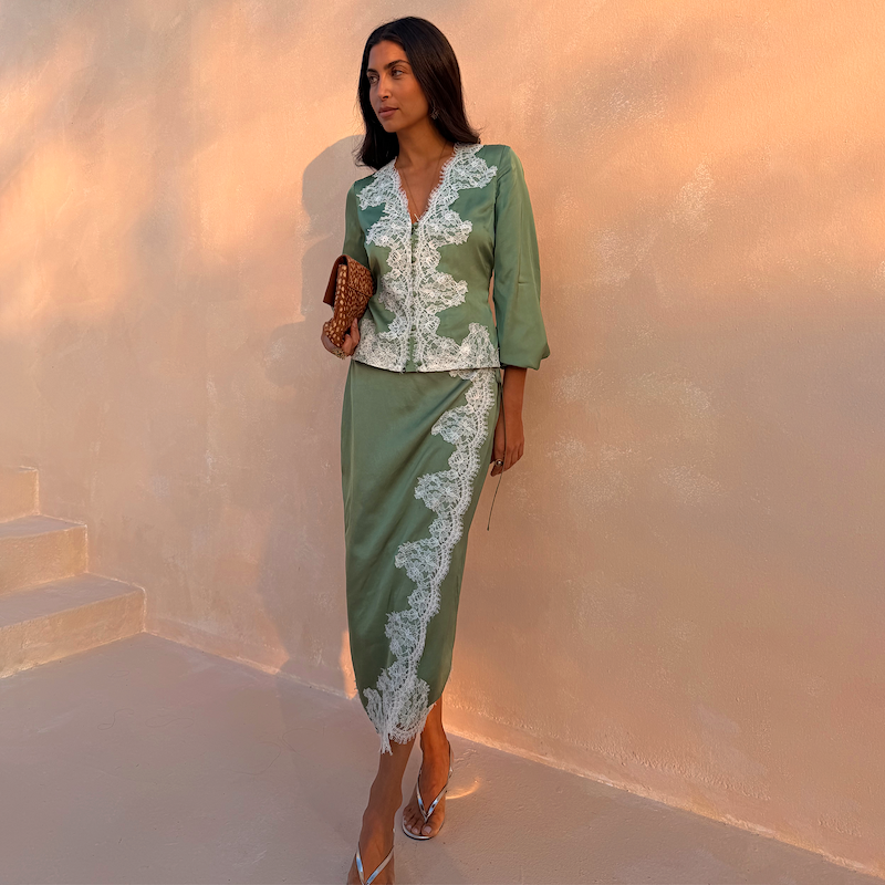 Green Lace Wrap Midi Skirt with white lace detailing, styled as a co-ord with a matching long-sleeve top.