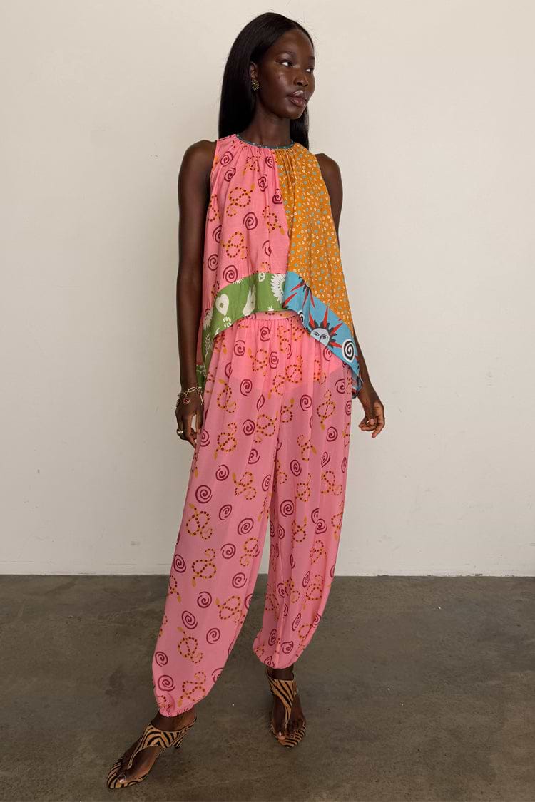 Pink Snake Balloon Trouser in dusky pink with a snake print and balloon silhouette, styled with a multi-print top.