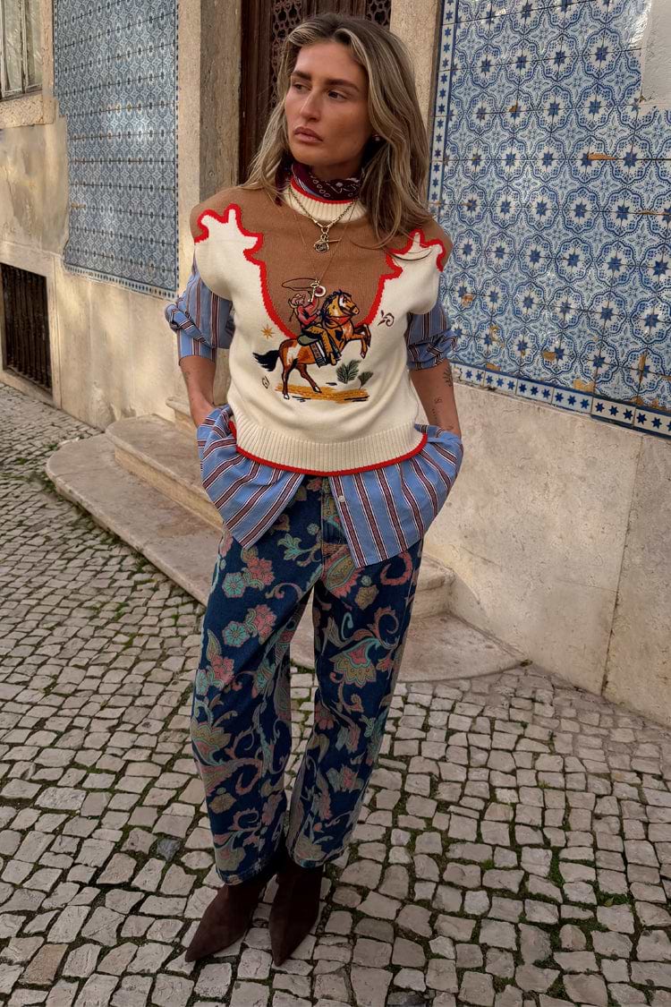 Blue Denim Paisley Barrel Leg Jeans featuring a bold print, styled with a cowboy vest for a London look.