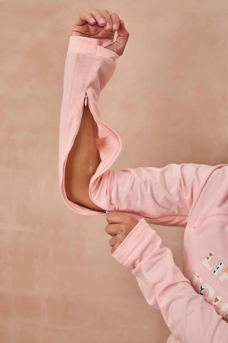 Pink Life is Tough long sleeve accessible t-shirt with a concealed zip along the arm for treatment access.