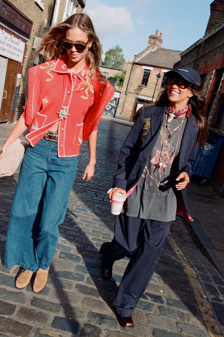Navy Pinstripe Arden Trousers and matching blazer styled with a graphic tee for a London street style look.