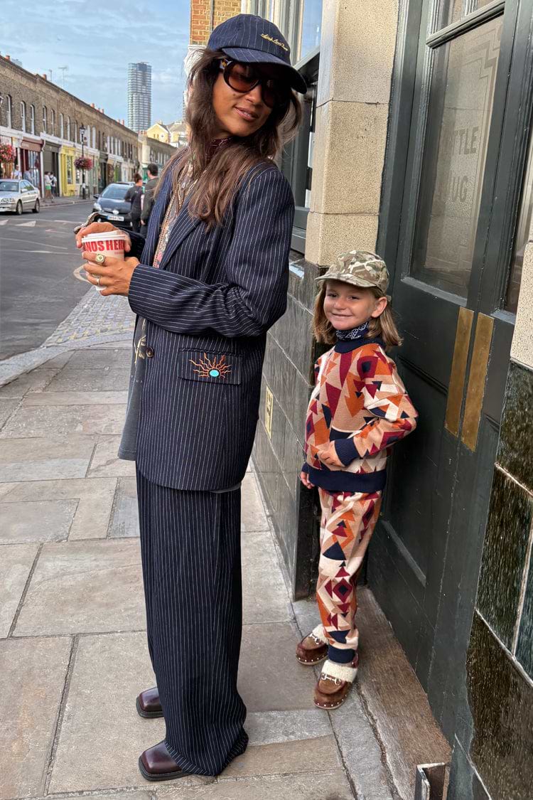 Petite Navy Pinstripe Arden Trousers and matching blazer styled for an iconic London look.