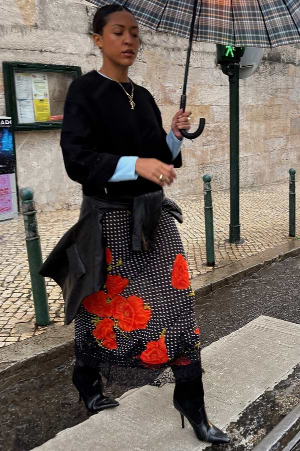 Black Poppy Midi Maeva Skirt with polka dots, poppy print and lace trim, styled in a street style look.