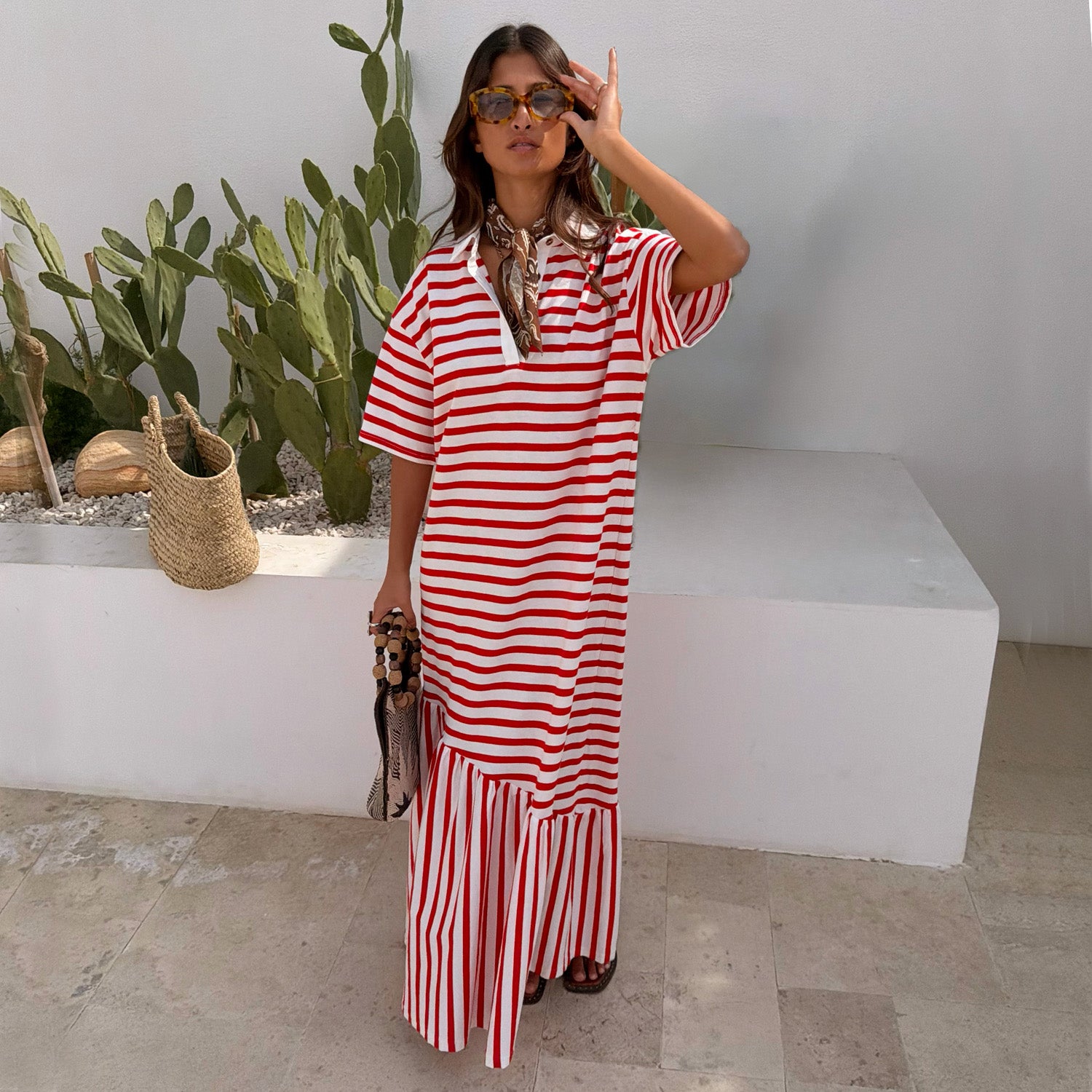 Red Stripe Jersey Dress in cotton with an asymmetric gathered skirt and buttoned neck for summer styling.