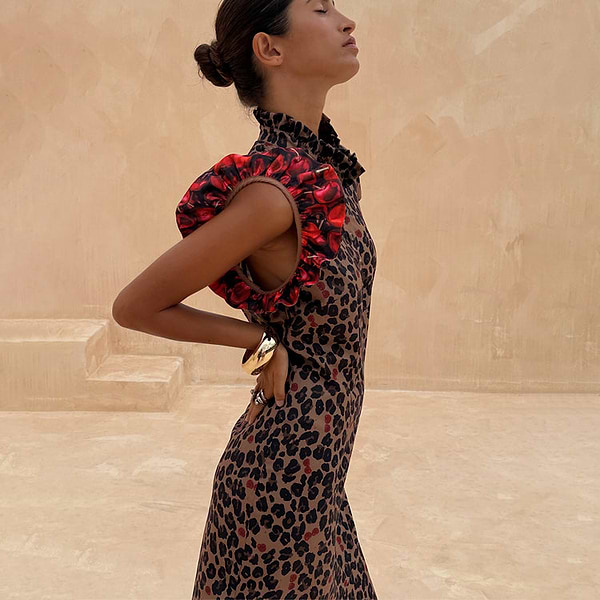 Cherry Leopard Remi Dress with leopard print, red cherry pleated frill sleeves and a high ruffled neck.