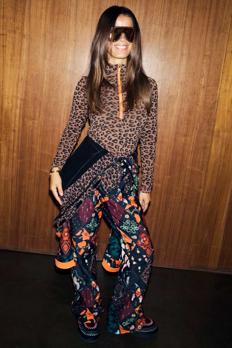 Night Garden Ski Suit with leopard and mystical motifs, tied at the waist over a leopard print base layer.