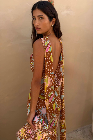 Star Fawn Sophie Dress in brown with a low back and detachable scarf detail, held with a matching clutch.